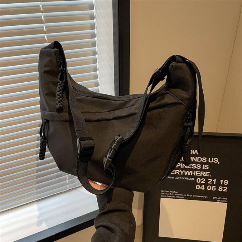 2025 Popular Oxford Cloth Messenger Bag for Women, new casual style with adjustable shoulder straps, large-capacity dumpling bag suitable for students' class and commuting, which can hold books, mobile phones and tablets simultaneously.